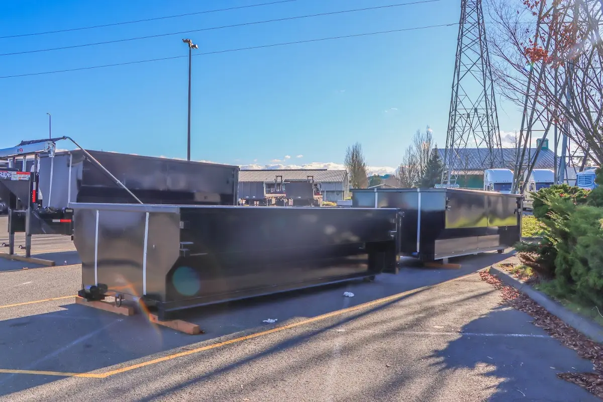 Roll-off dumpster ready for waste disposal at job site for 15 Yard Dumpster Rental in Canton